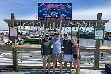 Young angler with Spanish mackerel on Carolina Beach half-day fishing charter aboard Wild Rover III